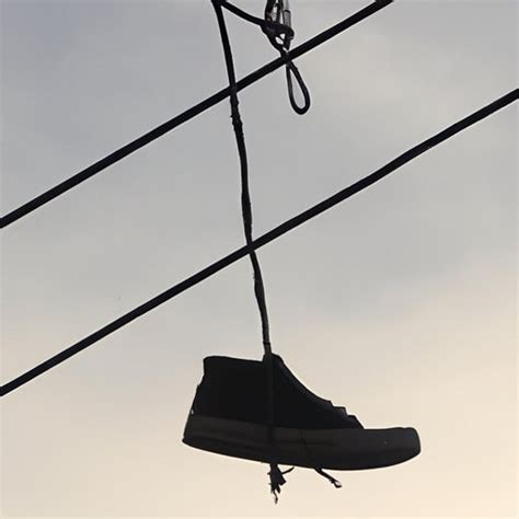 shoes on telephone wire meaning.